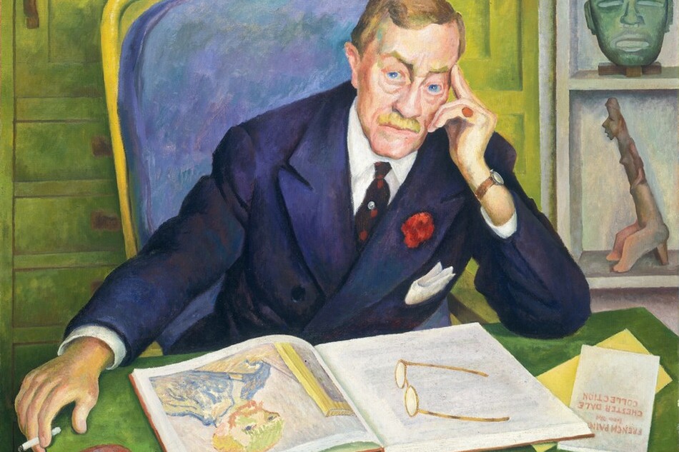 A pale-skinned man leans forward so his arms rest on the desk in front of us as he looks out with piercing blue eyes in this horizontal portrait painting. He rests his head in his left hand, to our right, with the first two fingers extended along his temple. His blond hair is carefully combed, and he has arched eyebrows, bags under his eyes, a wide nose, and a bristle mustache over his square, cleft chin. He wears a navy-blue suit jacket over a white button-down and dark tie. The jacket has a white pocket square and a red flower on one lapel. The man wears a red pinky ring on the hand by his face. The other arm is extended so that hand, which holds a cigarette, hangs beyond the edge of the tabletop. We look slightly down onto the desk where a pair of glasses rests on an open book, which shows a self portrait by Van Gogh. A pamphlet partially tucked under one corner of the book would read, in full, “FRENCH PAINTING from the CHESTER DALE COLLECTION.” The man sits in a high-backed chair with cushion mottled with amethyst purple and topaz blue. Close behind him, a shelf to our right holds a copper-green mask and a figurine. Pale green paneling and drawers fill the left two-thirds of the background. The painting is inscribed at the top left, “To my very dear friend Chester Dale Diego Rivera. August 1945.” Brushstrokes are visible in some areas, especially in the background and chair.