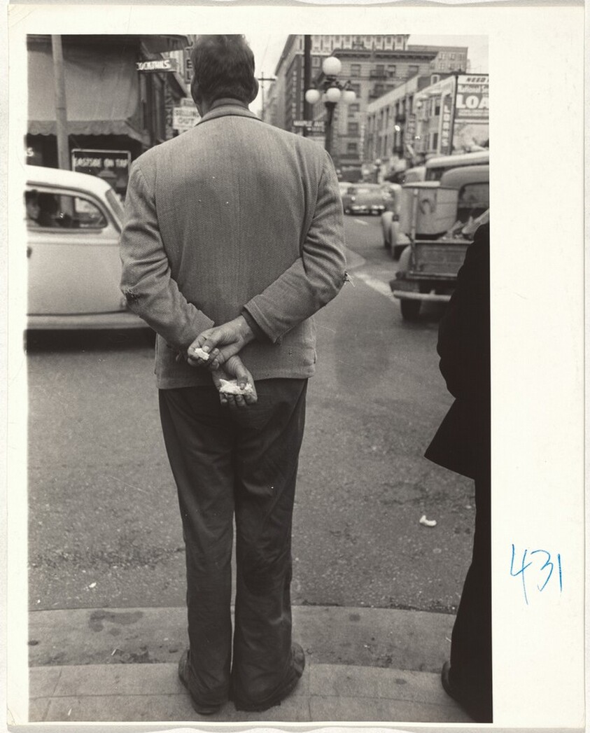 Man waiting to cross street--Los Angeles