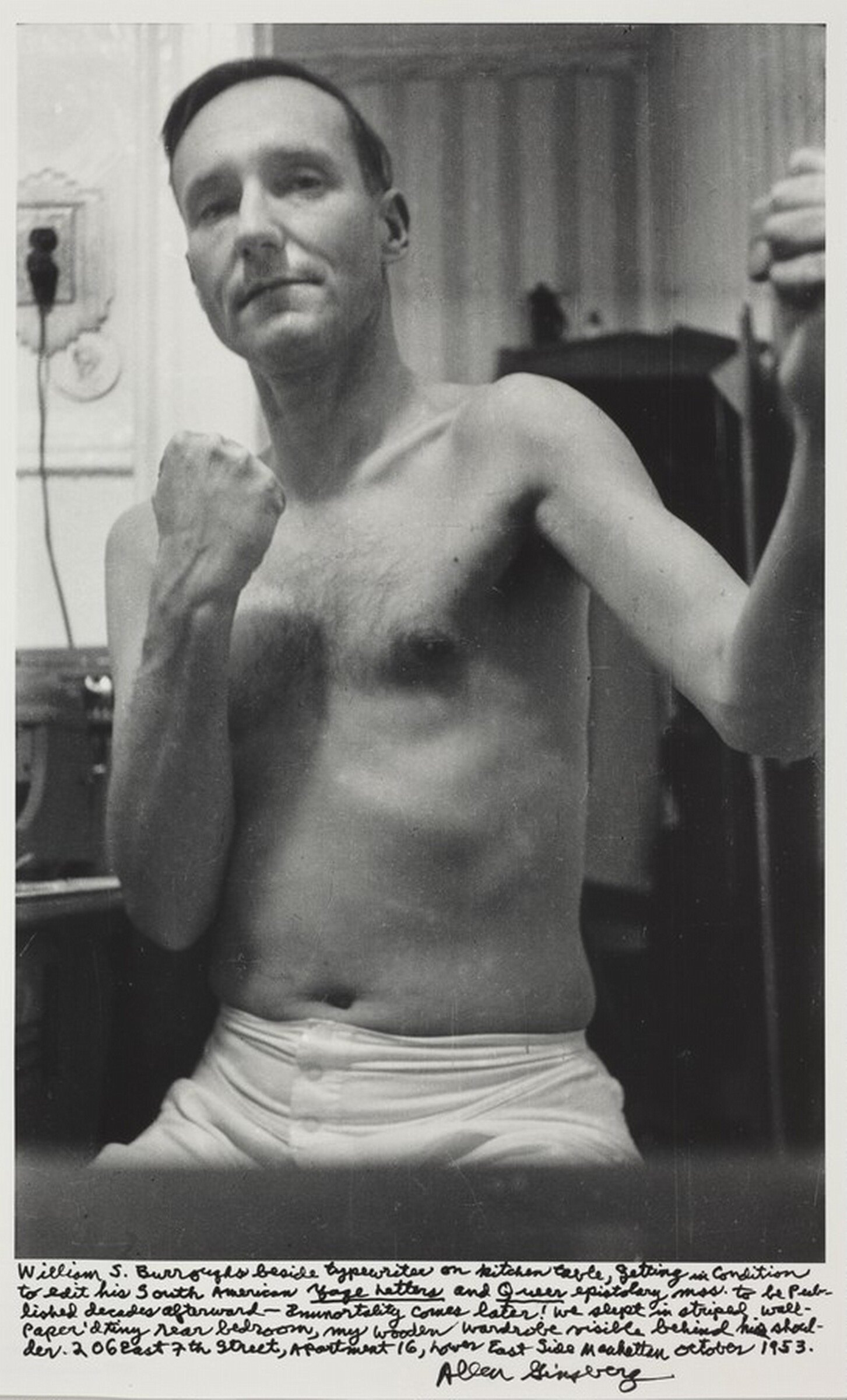 William S. Burroughs beside typewriter on kitchen table, getting in condition to edit his South American "Yage Letters" and "Queer" epistolary mss. to be published decades afterward - immortality comes later! We slept in striped wallpaper'd tiny rear bedroom, my wooden wardrobe visible behind his shoulder. 206 East 7th Street, Apartment 16, Lower East Side Manhattan October 1953., Allen Ginsberg, 1953, printed later