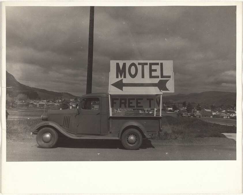 Motel sign on truck--California