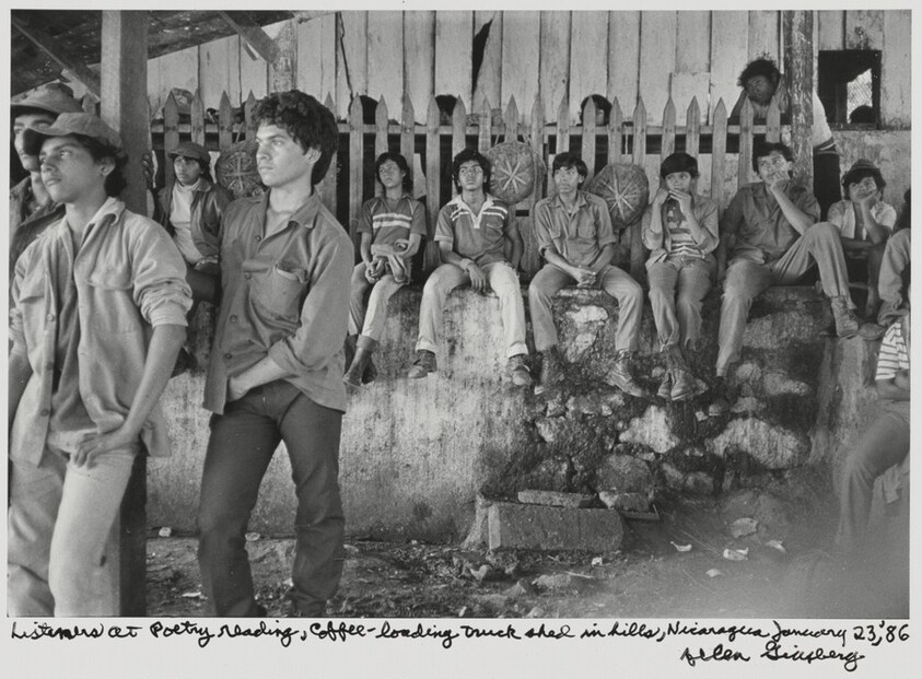 Listeners at Poetry reading, coffee-loading truck shed in hills, Nicaragua, January 23, '86