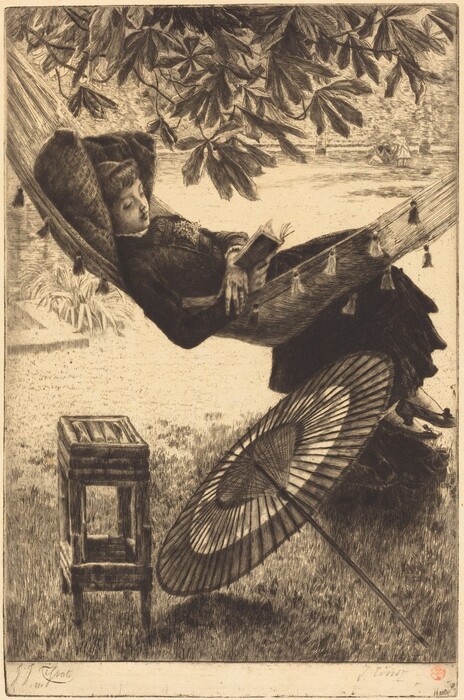 The image shows a woman in a hammock hanging under a leafy tree. She is reclining with a book in her right hand. She has her eyes closed and looks relaxed, with her hair styled neatly under a feathered hat. She is wearing a long-sleeved dress with lace details. Nearby, there is a wooden stool and an open parasol on the grass. The background has more leafy branches overhead and a grassy area.