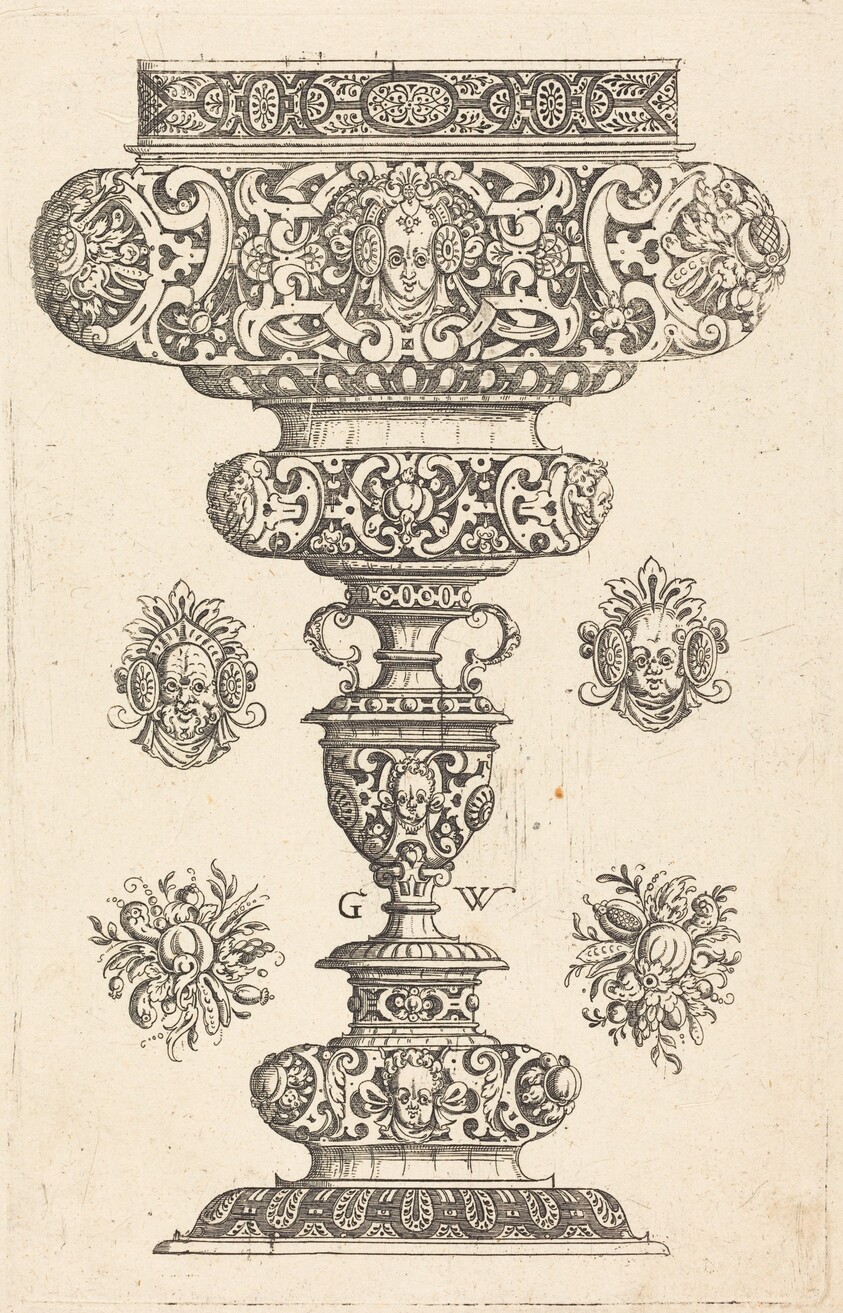 Goblet, rim decorated with masque and bouquet of fruit