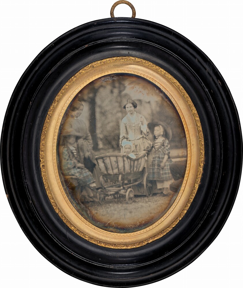 Two Women and Three Children in Garden