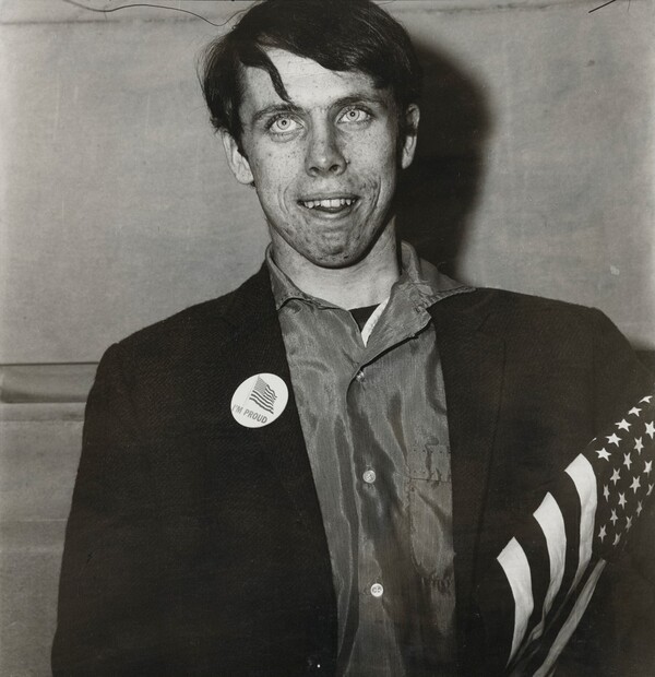 Patriotic young man with a flag, N.Y.C. 1967