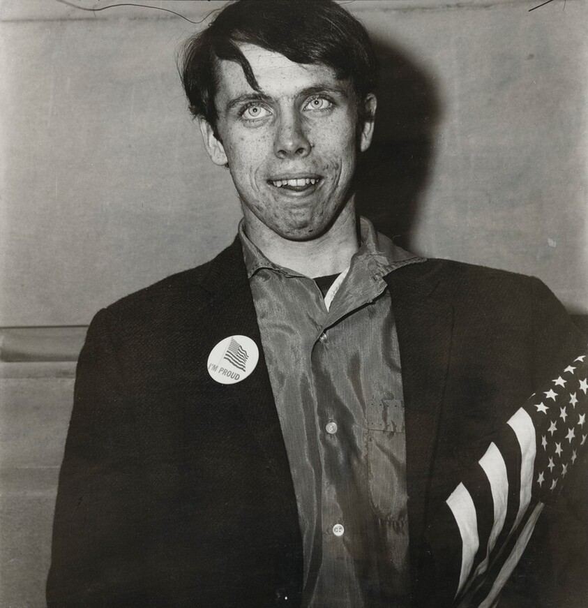 Patriotic young man with a flag, N.Y.C. 1967