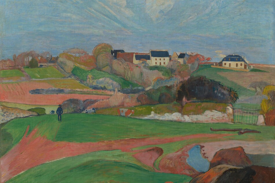 We look across rolling, bright green pastures and honey-brown farmland to a cluster of buildings nestled beyond a copse of trees, along the horizon in this horizontal, stylized landscape painting. The scene is painted with mostly flat areas of color. Closest to us, low, vibrant green pastures are bisected by a narrow, gingerbread-brown path. The path meanders from the lower left corner of the composition to a metal gate, near the right edge of the painting. A short distance from us to our left, a man wearing navy-blue pants, shirt, and hat walks along the top of a hill, hands in pockets. Two black and white cows and one brown and white cow graze nearby. In the distance, the copse of trees is painted with pockets of pumpkin orange, lavender purple, sky blue, and spring and muted sage green. Beyond the trees, a white, square, two-story house with a spruce-blue roof sits within the grouping of buildings. Another white building with a blue roof stands a bit to our right. Wisps of white clouds dot a vivid blue sky, which is tinted with pale pink and lilac purple near the horizon. The artist signed and dated the work in harvest yellow against a mound of dark brown rocks in the lower right corner: “P. Gauguin 90.”