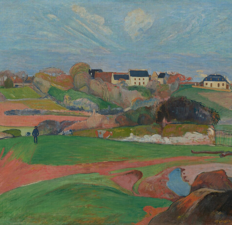 We look across rolling, bright green pastures and honey-brown farmland to a cluster of buildings nestled beyond a copse of trees, along the horizon in this horizontal, stylized landscape painting. The scene is painted with mostly flat areas of color. Closest to us, low, vibrant green pastures are bisected by a narrow, gingerbread-brown path. The path meanders from the lower left corner of the composition to a metal gate, near the right edge of the painting. A short distance from us to our left, a man wearing navy-blue pants, shirt, and hat walks along the top of a hill, hands in pockets. Two black and white cows and one brown and white cow graze nearby. In the distance, the copse of trees is painted with pockets of pumpkin orange, lavender purple, sky blue, and spring and muted sage green. Beyond the trees, a white, square, two-story house with a spruce-blue roof sits within the grouping of buildings. Another white building with a blue roof stands a bit to our right. Wisps of white clouds dot a vivid blue sky, which is tinted with pale pink and lilac purple near the horizon. The artist signed and dated the work in harvest yellow against a mound of dark brown rocks in the lower right corner: “P. Gauguin 90.”