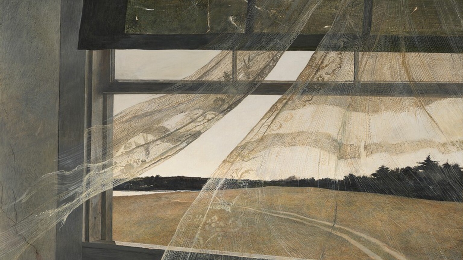 An open window with semi-transparent curtains blowing in the breeze looking out onto an empty field with trees in the background.